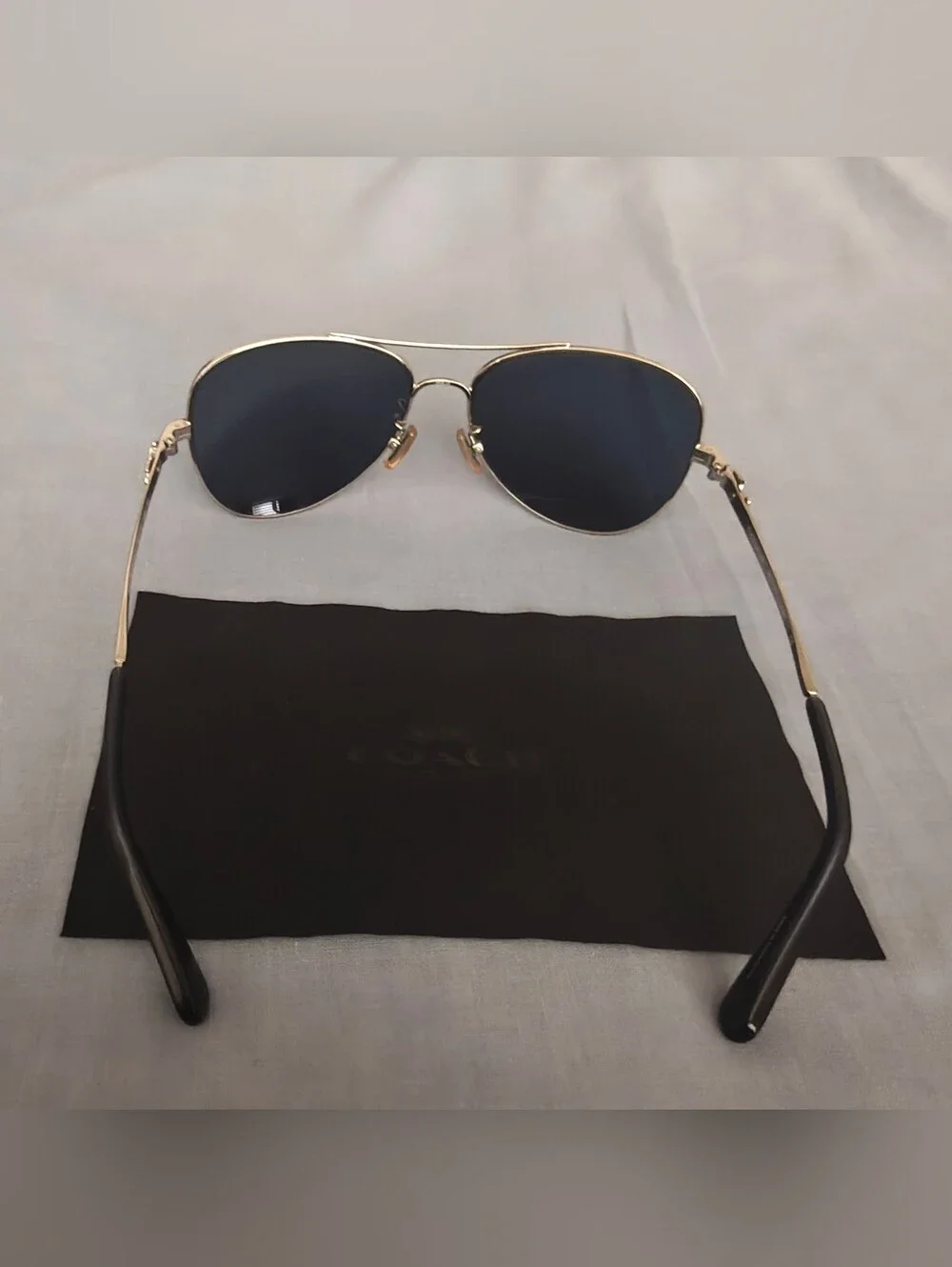 Coach Sunglasses with Silver Frame and Blue Lenses